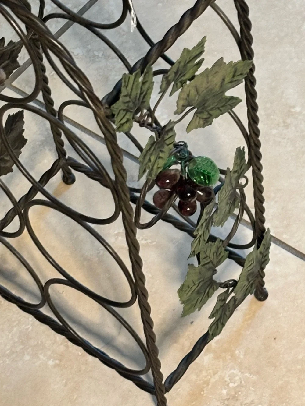 Black Metal Wine Bottle Rack with Decorative Leaf Accents